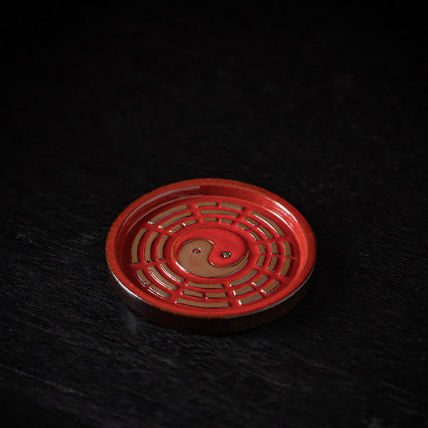 Red Bagua Ceramic Plate – Vermilion dish with bronze yin-yang and eight trigram cutouts, incense base