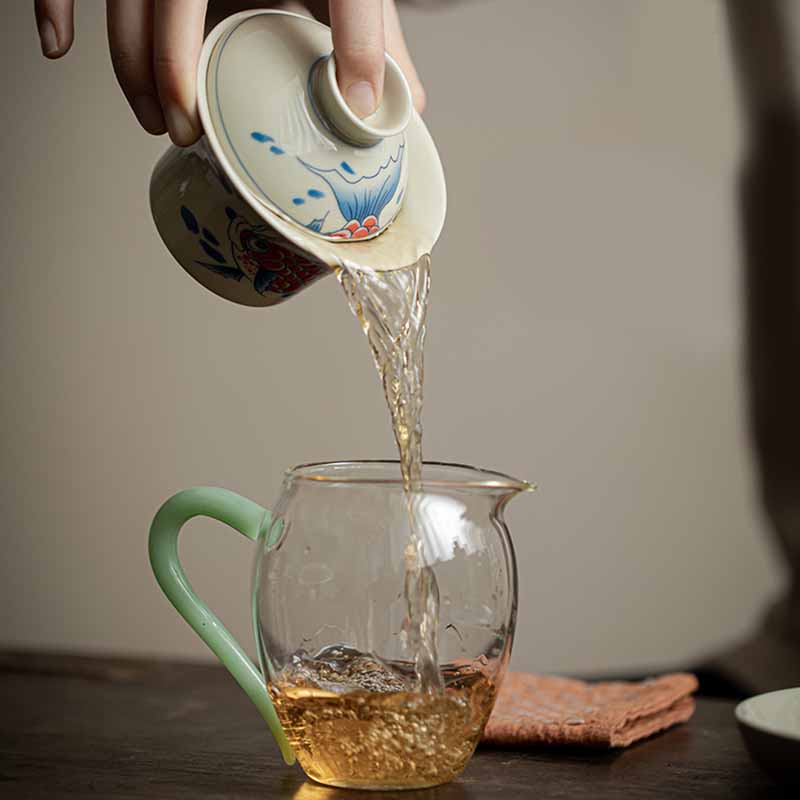 Koi Sancai Cup – held in hand with lid on showing size, gaiwan teacup
