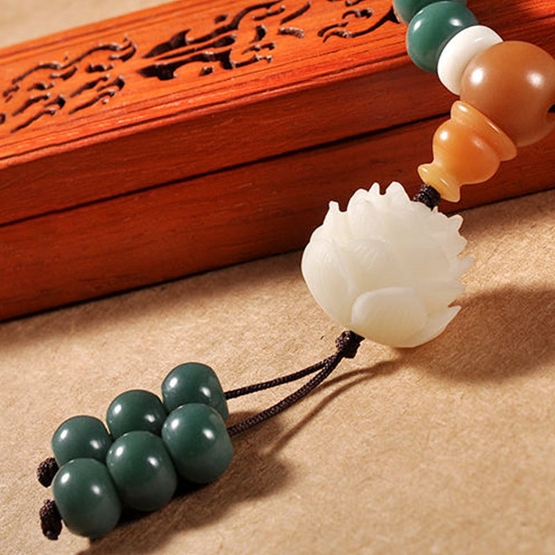 Lotus Cyan Bodhi Seed Bracelet - carved white lotus on green jade beads with gourd accent, wooden box display
