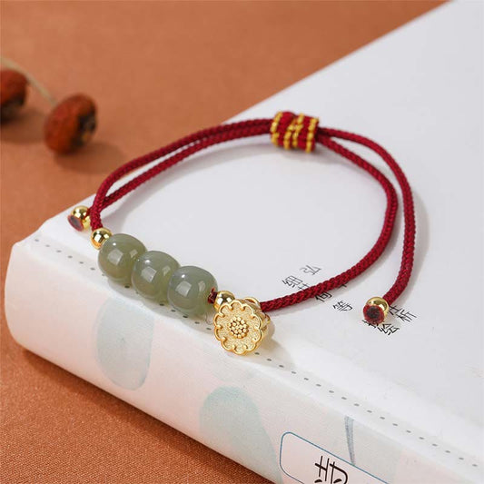Hetian Jade Lotus Pod Braided Bracelet – red cord with jade beads on classic book, auspicious