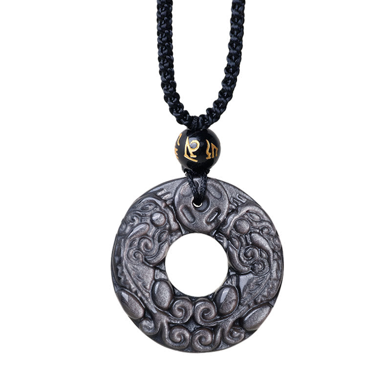 Silver Sheen Obsidian Double PiXiu Necklace – Isolated obsidian PiXiu disc with gold accent on white, spiritual gift