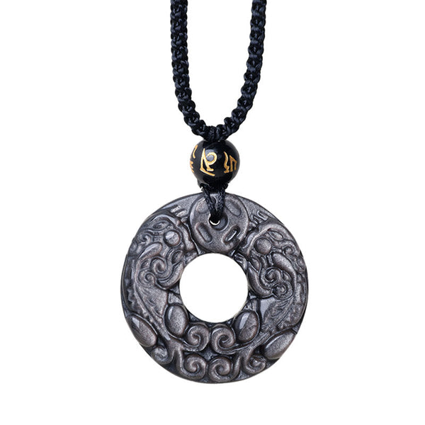 Silver Sheen Obsidian Double PiXiu Necklace – Isolated obsidian PiXiu disc with gold accent on white, spiritual gift
