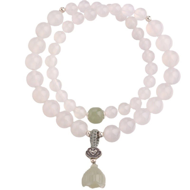White Agate Jade Lotus Bracelet - Circular layout on white background with silver filigree and lotus bud charm, studio photo
