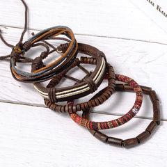 Red Sandalwood Hemp Leather Wrap Bracelet – four layered leather and fabric bracelets on whitewashed wood, earth tones