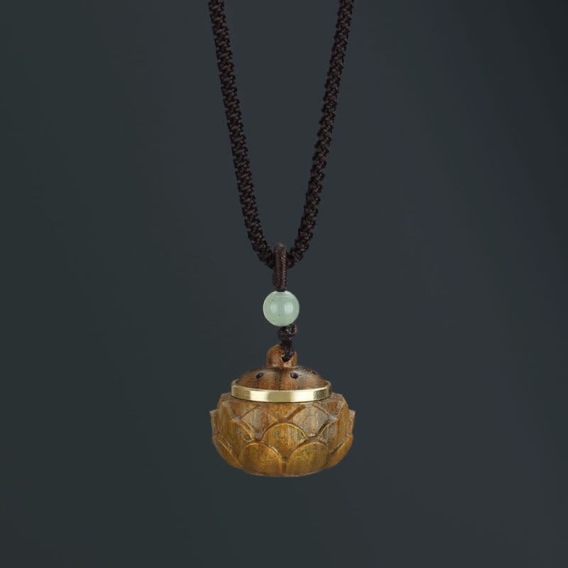 Om Mani Padme Hum Necklace – Carved lotus dome pendant with gold metal rim and perforated lid, jade bead, diffuser