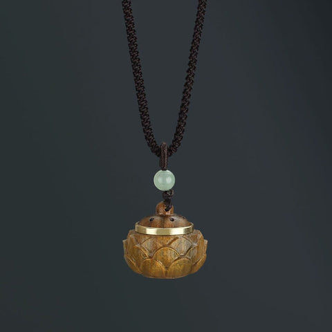 Om Mani Padme Hum Necklace – Carved lotus dome pendant with gold metal rim and perforated lid, jade bead, diffuser Imagen principal del producto