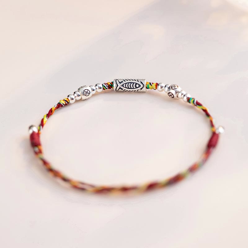 925 Koi Braided Bracelet - worn on wrist, colorful threads and silver koi charm, adjustable