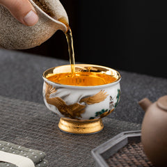 Golden Eagle Dragon Gilt Ceramic Teacup – golden eagle with pine tree, tea pouring action, gold-plated interior, ceremonial