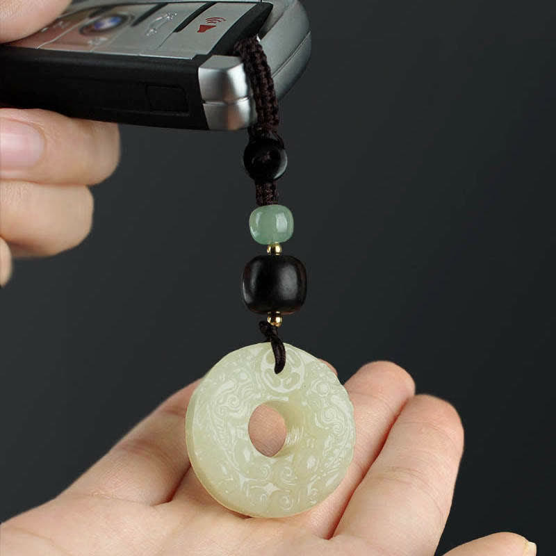 Jade PiXiu Peace Buckle Abundance Key Chain – Carved jade peace buckle keychain on car key in hand, wealth accessory