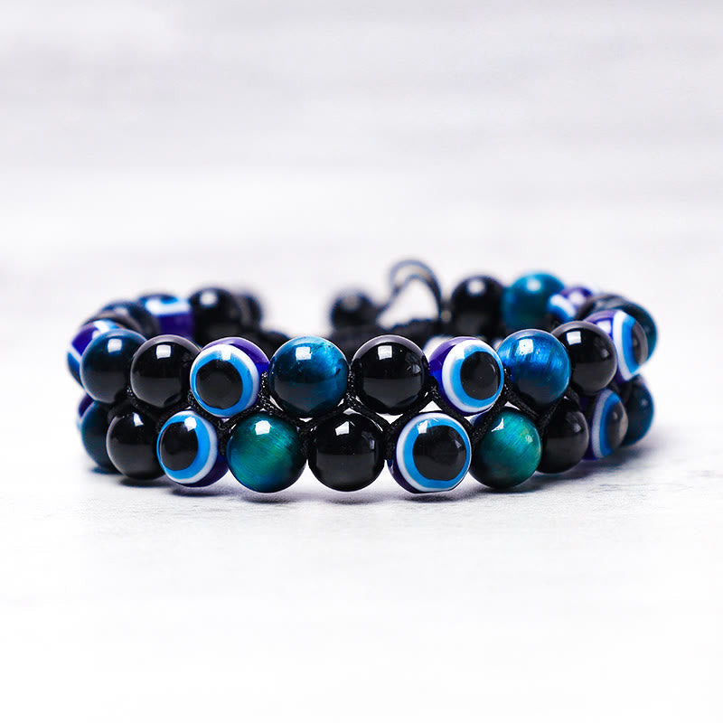 Evil Eye Tiger Eye Bracelet – two-row hematite and tiger eye beaded bracelet with nazar beads, top-down view