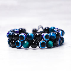 Evil Eye Tiger Eye Bracelet – two-row hematite and tiger eye beaded bracelet with nazar beads, top-down view