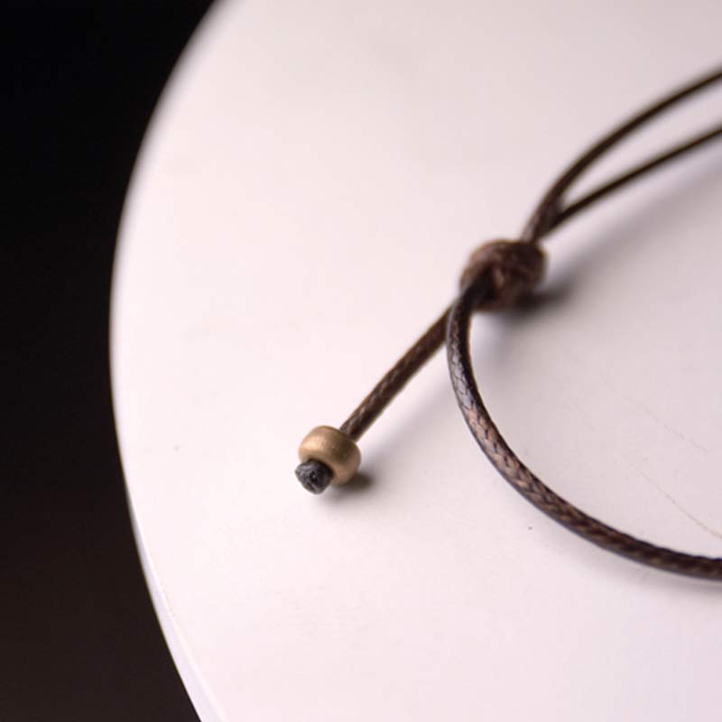 Zen Circle Ebony Wood Necklace - sliding knot closure with brass bead on brown cord, craftsmanship