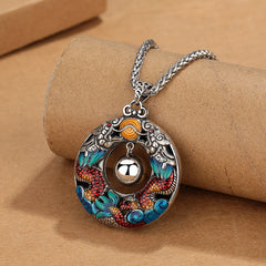 Double Dragon Copper Necklace – Oxidized silver dragon medallion with red blue enamel, harmony ball, kraft display