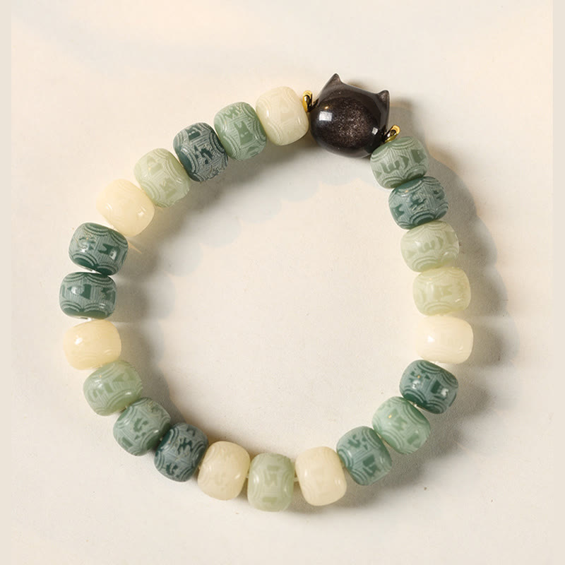 Bodhi Seed Cat Head Bracelet – Cream to teal gradient beads with carved patterns and black cat charm on white background, harmony bracelet