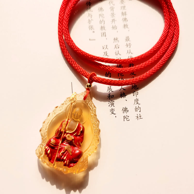 Ksitigarbha Buddha Liuli Crystal Necklace – Polished crystal pendant reflecting warm candlelight, temple inspired design