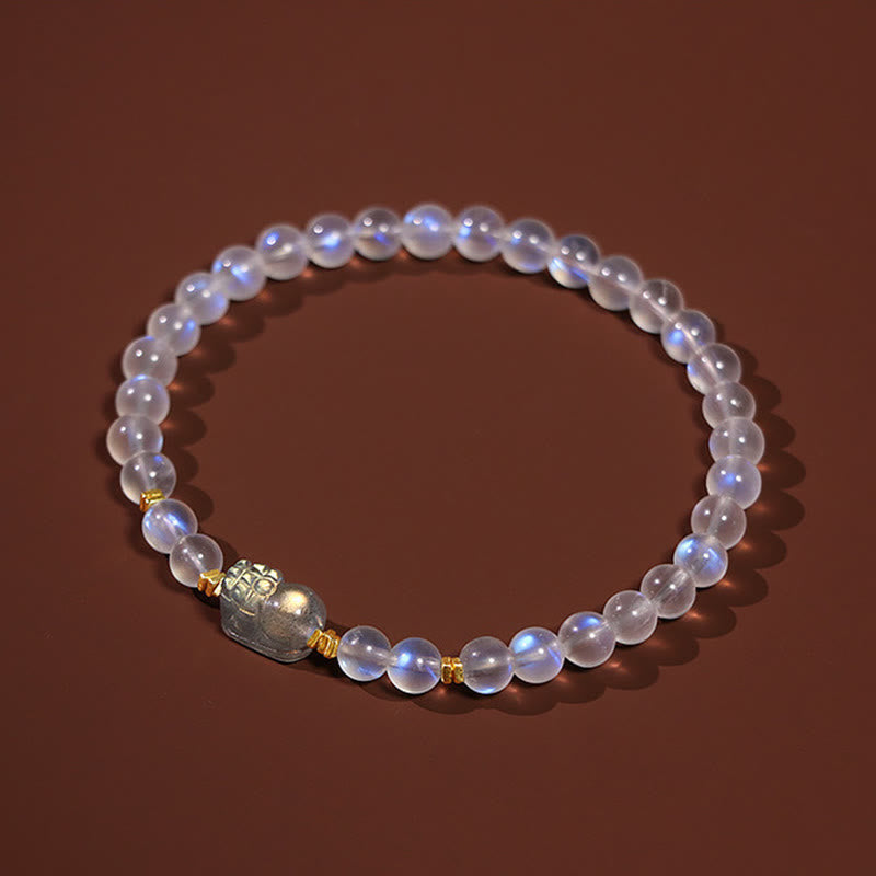 Moonstone PiXiu Bracelet – Moonstone bracelet on plush velvet pedestal with gold spacers, tranquility