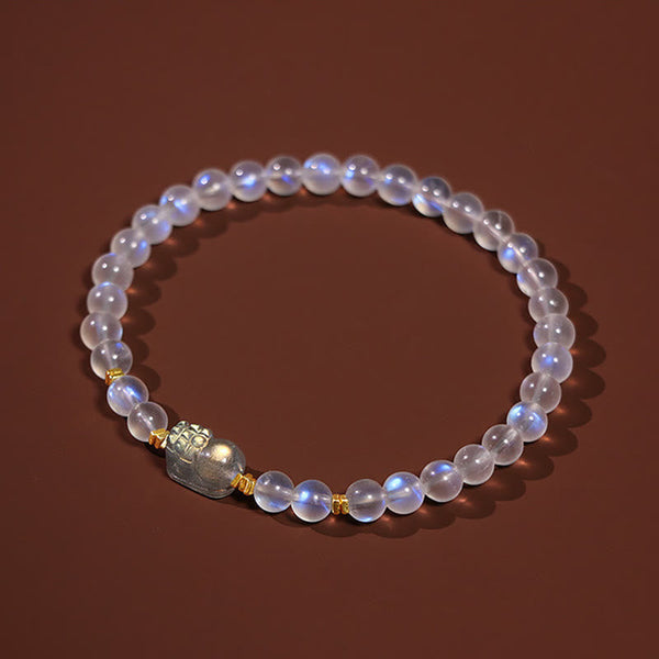 Moonstone PiXiu Bracelet – Moonstone bracelet on plush velvet pedestal with gold spacers, tranquility