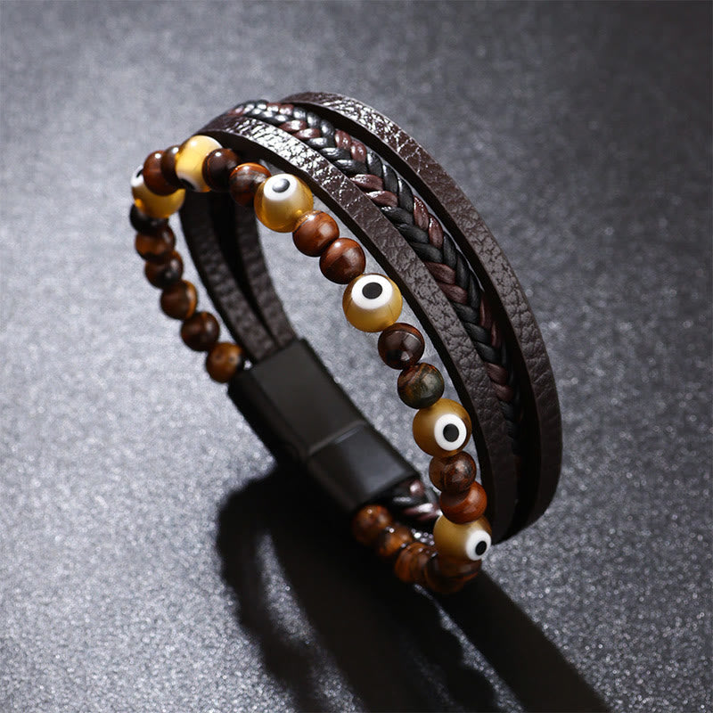 Evil Eye Tiger Eye Bracelet – Brown tiger eye beaded leather bracelet with nazar charms on dark surface