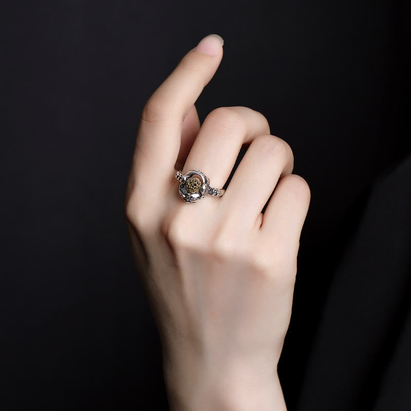 Sterling Silver PiXiu Wealth Ring – Silver pixiu ring worn on finger against black, adjustable wealth ring