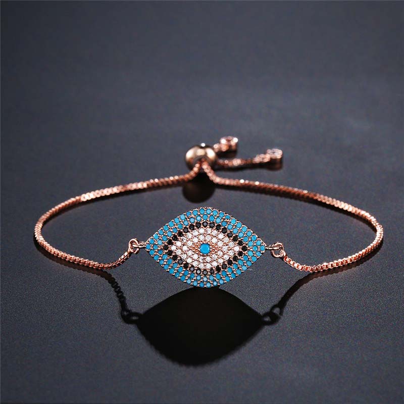 Evil Eye Healing Bracelet – Rose gold diamond shape evil eye bracelet on matte black, healing jewelry