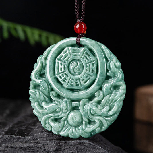 Dragon Jade Yin Yang Necklace – Green jade donut pendant on black cord worn on collarbone, dark gray textured background, lifestyle side shot