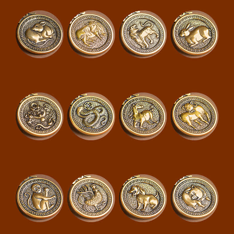 12 Chinese Zodiac Fortune Necklace Pendant – Complete set of twelve Chinese zodiac medallion pendants in 3x4 grid, antique gold brass with animal reliefs, Rat Ox Tiger Rabbit Dragon Snake Horse Goat Monkey Rooster Dog Pig, Greek key borders, rust background, zodiac collectible