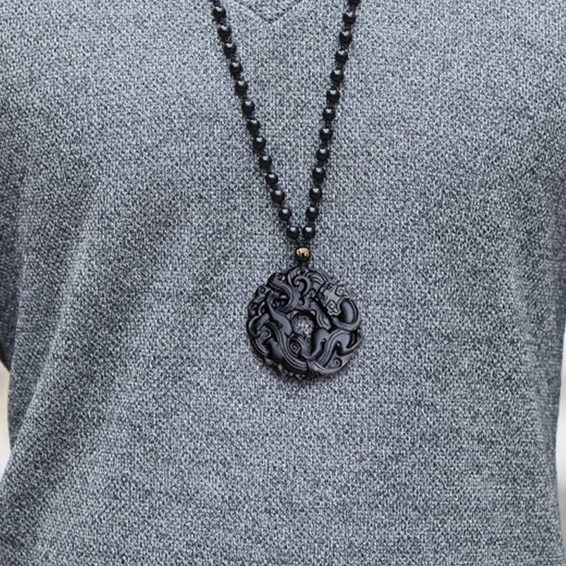 Black Obsidian Pixiu Pendant – Man wearing black obsidian pendant on gray knit sweater