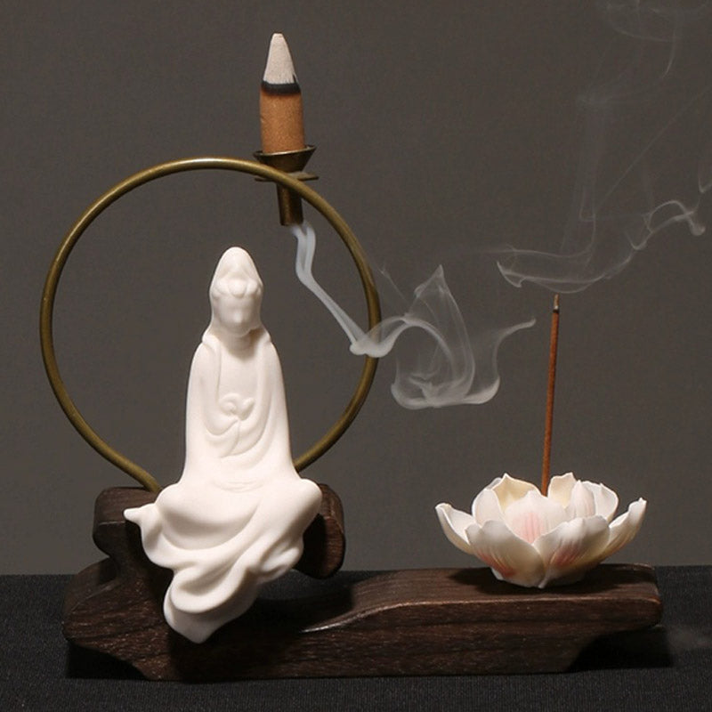 Ceramic Lotus Incense Burner – white Guanyin drapery, brass halo, smoke, wood stand, peace