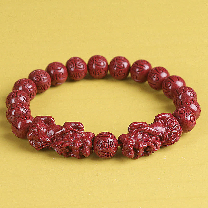 Double PiXiu Cinnabar Bracelet – Red carved mantra beads with two PiXiu guardians on yellow, luck bracelet