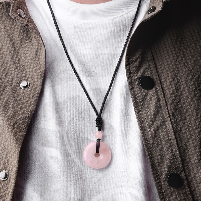 Lucky Coin Pendant Healing Crystal Gemstone Necklace – Pink rose quartz donut pendant necklace worn casually over white shirt
