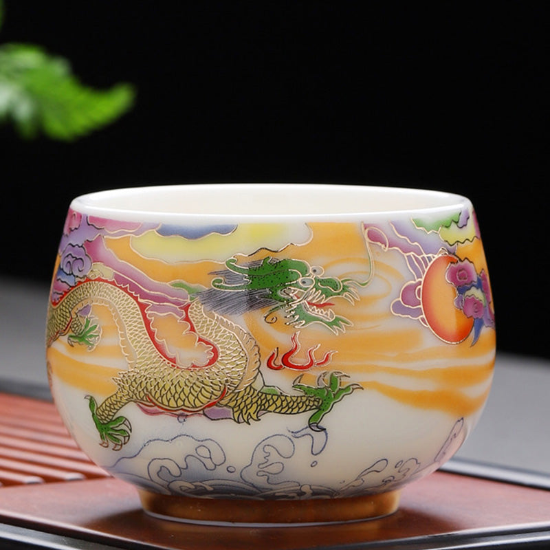 Dragon Phoenix Ceramic Teacup - Green-headed dragon on gold clouds against black, collectible