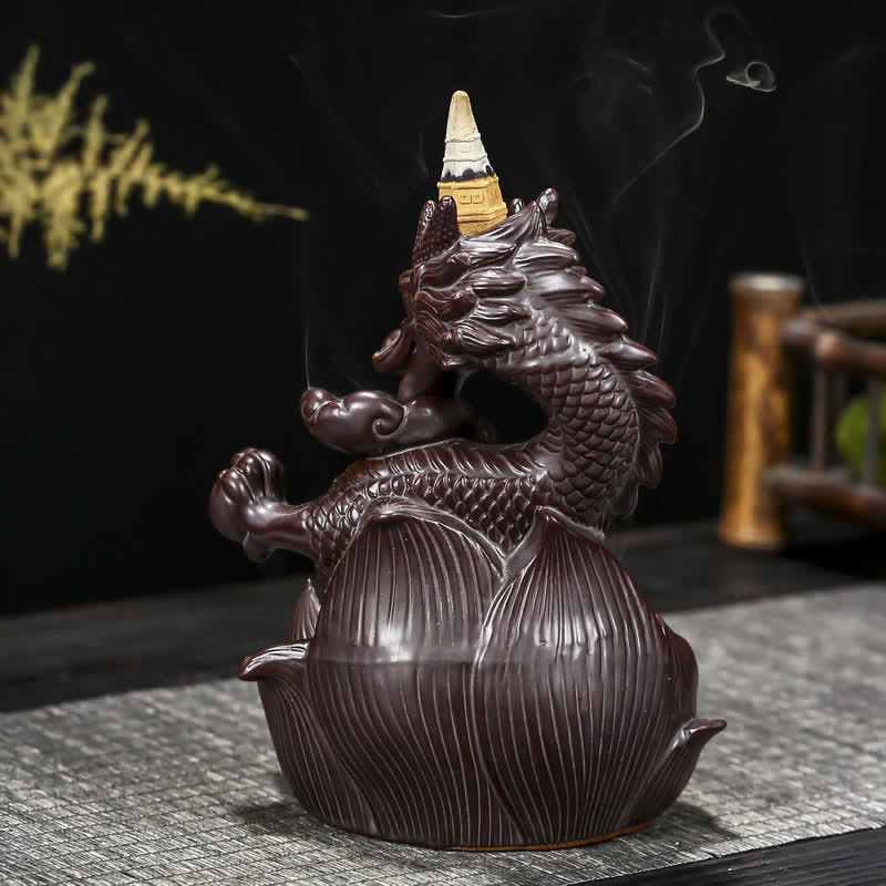 Dragon Lotus Ceramic Incense Burner – Three-quarter view with golden bamboo background and active smoke cascade, Zen