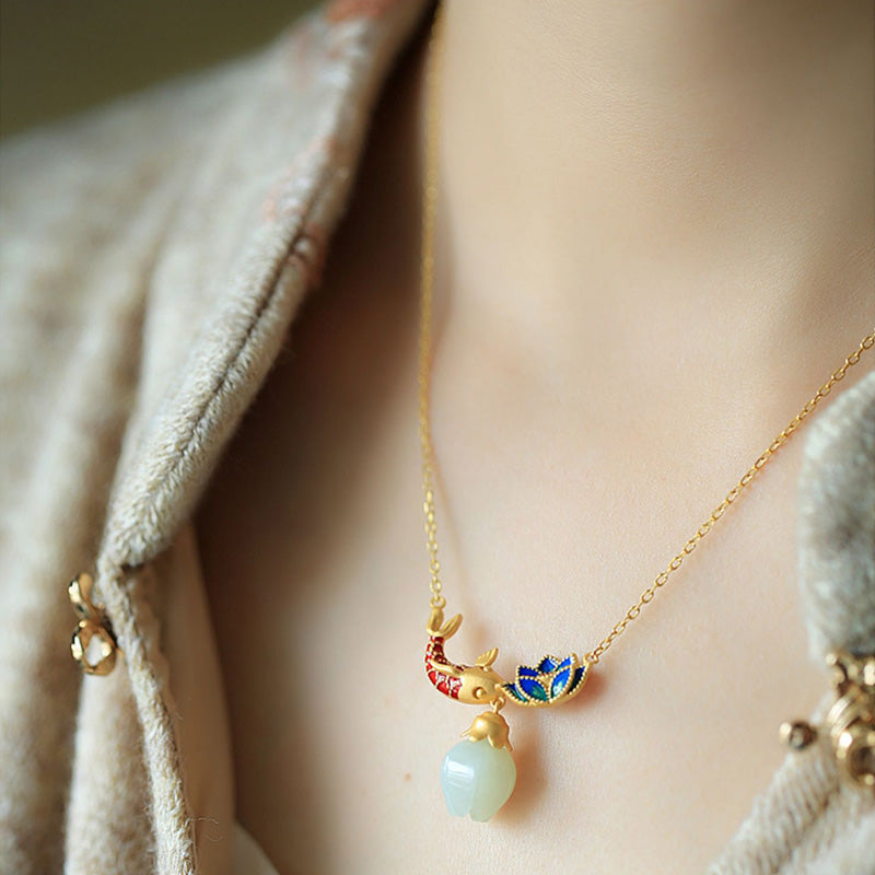 White Jade Koi Fish Necklace – worn on model with cream linen collar, koi lotus pendant with jade drop, lifestyle shot