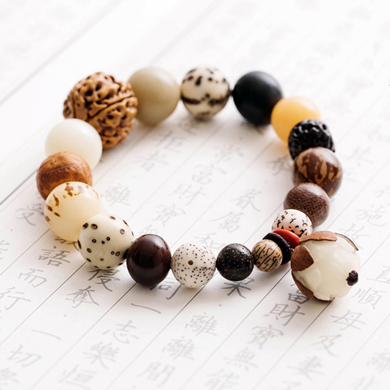 Bodhi Seed Lotus Mala – On calligraphy paper showing star bodhi seed and lotus bead, peace
