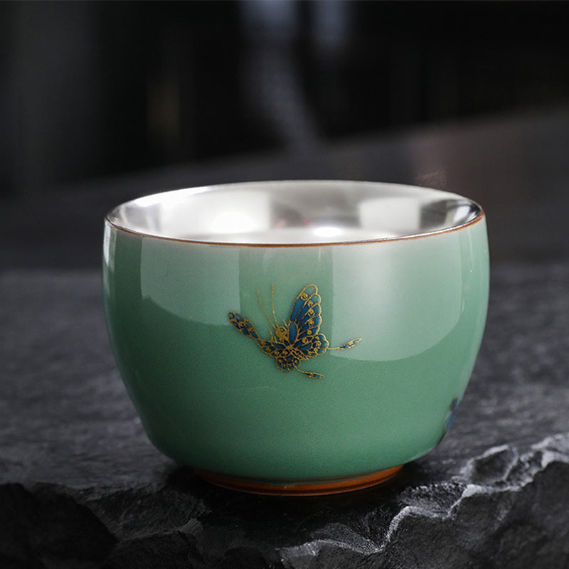 Butterfly Koi Lotus Cup – angled top-down showing goldfish and lotus, teaware