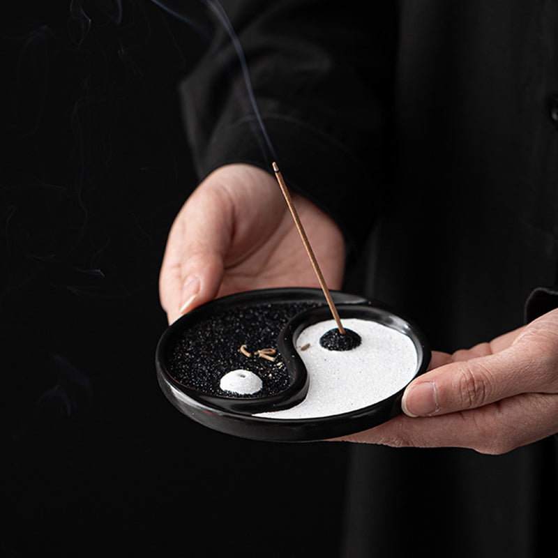 Yin Yang Incense Holder – Two hands cradling dish with glowing incense smoke, Peaceful