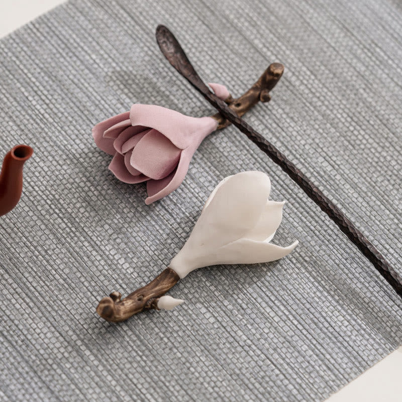 Gardenia Ceramic Incense Burner – Pink and white magnolia on gray woven mat, teapot spout visible