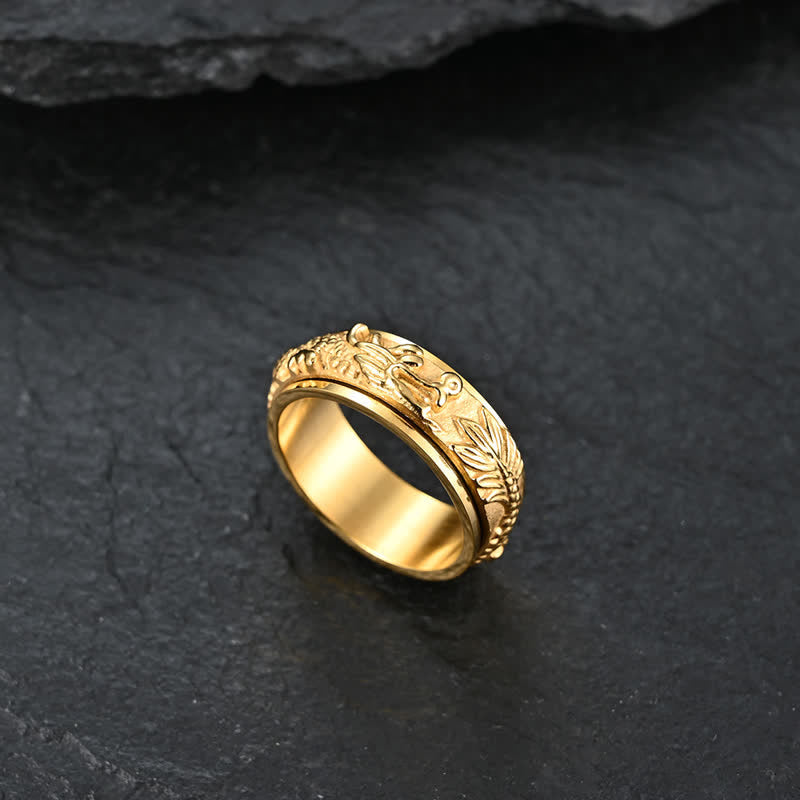 Dragon Titanium Steel Ring – Gold dragon spinner on dark slate, powerful