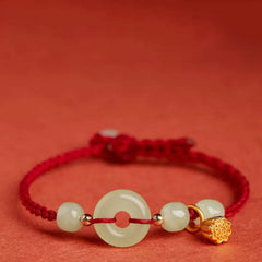 Jade Peace Buckle Lotus Bracelet – close-up of carved jade peace buckle with lotus pod charm detail, Serene