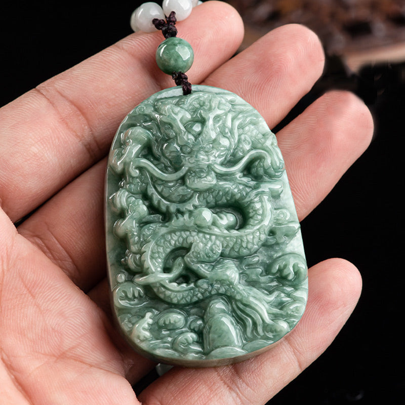 Chinese Zodiac Dragon Jade Necklace - Green jadeite dragon carving held in palm with braided cord, Abundance