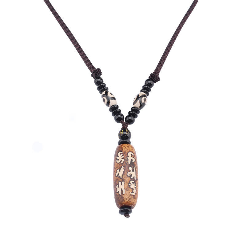 Dzi Bead Necklace – Centered Om Mani Padme Hum pendant on brown cord with gold-accented bead, harmonious