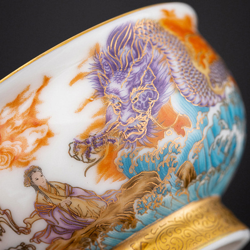 Golden Eagle Dragon Gilt Ceramic Teacup – side profile with purple dragon, robed deity, and ornate gold foot, white background