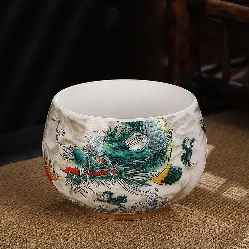 Dragon Cicada Ceramic Tea Bowl - emerald green dragon with vermilion flames on textured cream glaze, traditional chawan style