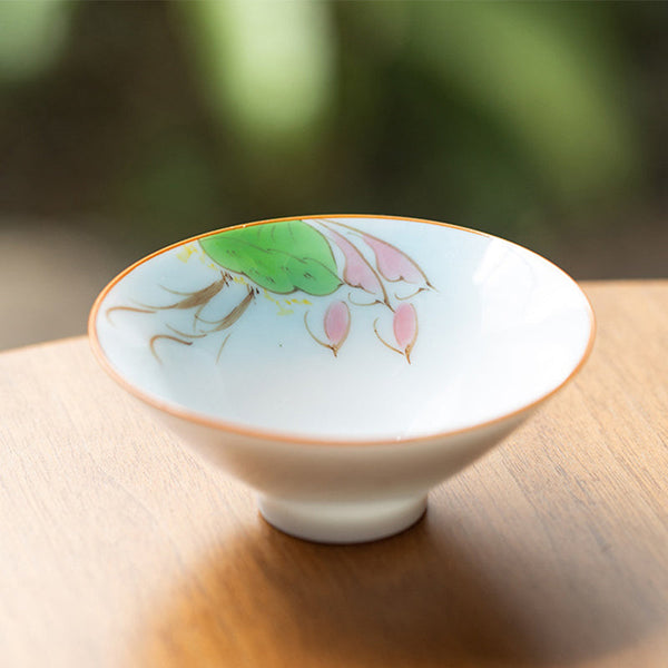 Mandala Koi Teacup – Close-up of colorful koi fish artwork on white ceramic surface