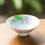 Mandala Koi Teacup – Close-up of colorful koi fish artwork on white ceramic surface