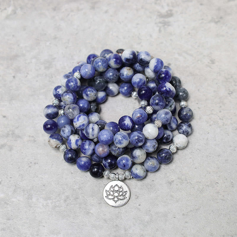 Blue Aventurine Lotus Peace Bracelet – concentric coiled natural stone beads with engraved lotus charm, blue and white gemstone wrap