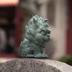 PiXiu Sandstone Statue – Side view of green carved PiXiu on rock, temple background, feng shui home decor
