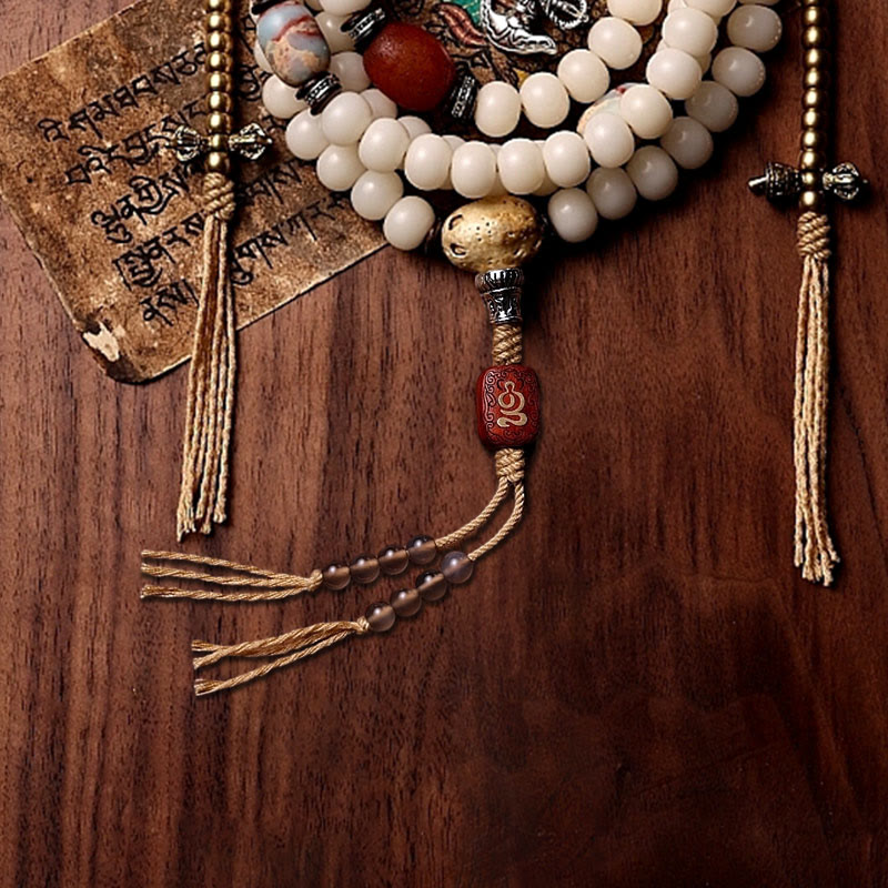 108 Mala Beads Bracelet – Gold guru bead, red carved focal, vajra charms