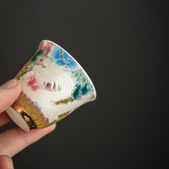 Dragon Phoenix Ceramic Teacup - Hand-held cup displaying raised dragon relief with gold trim, Luxurious