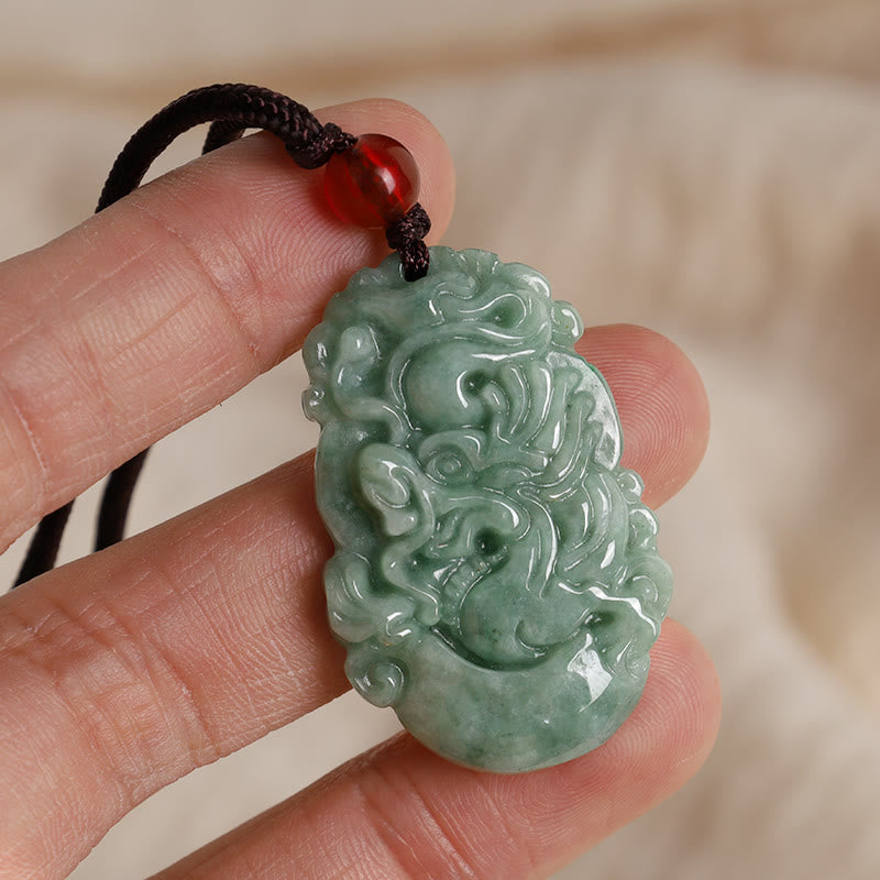 Jade Zodiac Prosperity Necklace – Dragon pendant held in hand showing scale, close-up, authentic